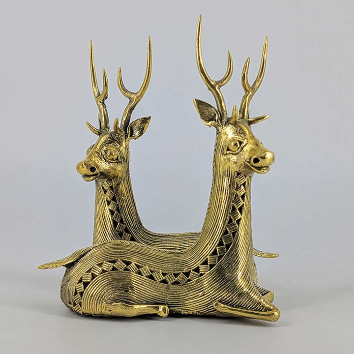 Elegant brass deer pair with elongated antlers, handcrafted using the lost-wax technique