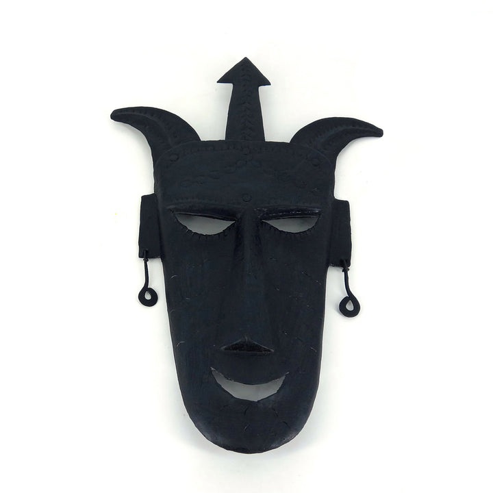 Close-up of Bastar iron craft detailing on Fierce Gaze mask