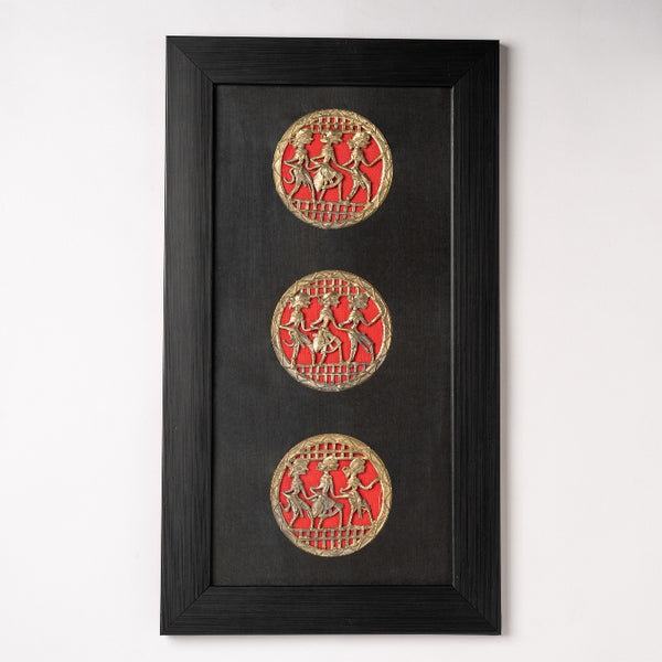 Handcrafted brass dance wall art with three vertical Dhokra panels on a deep black mount.