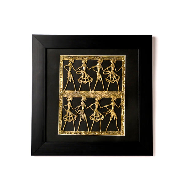Handcrafted brass dance wall art featuring tribal dancers moving rhythmically to a drummer’s beats.