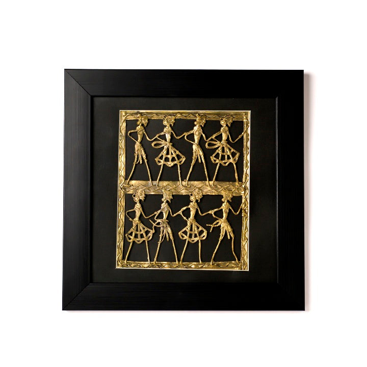 Handcrafted brass dance wall art featuring tribal dancers moving rhythmically to a drummer’s beats.