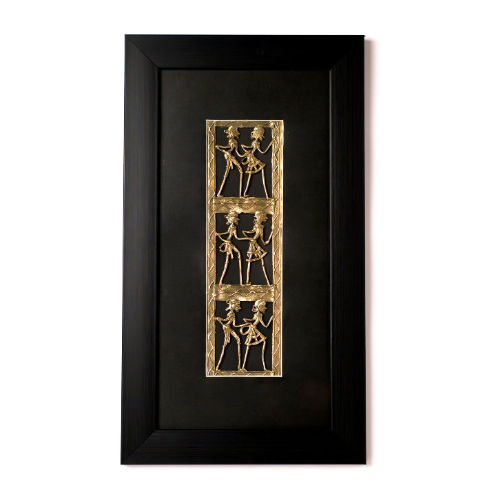 Handcrafted brass dance wall art with three vertical Dhokra panels on a sophisticated black mount.