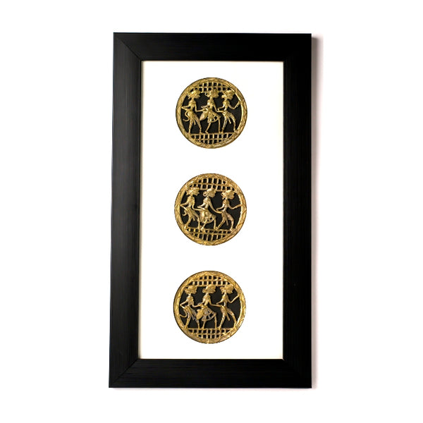 Handcrafted brass dance wall art with three Dhokra medallions on a white mount sheet.