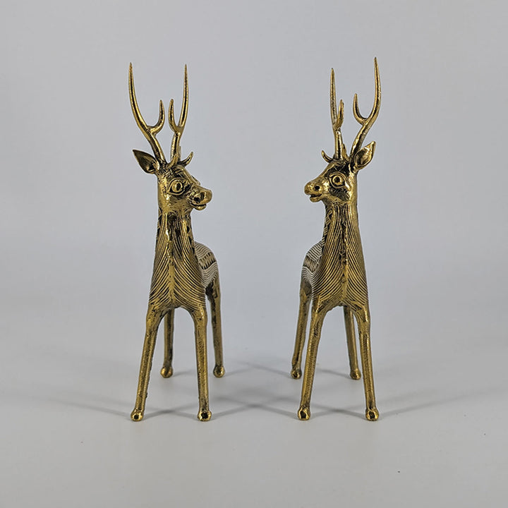 Elegant brass deer sculptures with tall, refined antlers, handcrafted using the lost-wax technique.