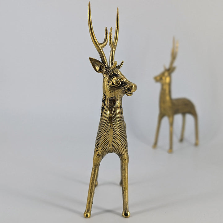 Close-up of intricate tribal patterns on brass standing deer pair.Close-up of intricate tribal patterns on brass standing deer pair.