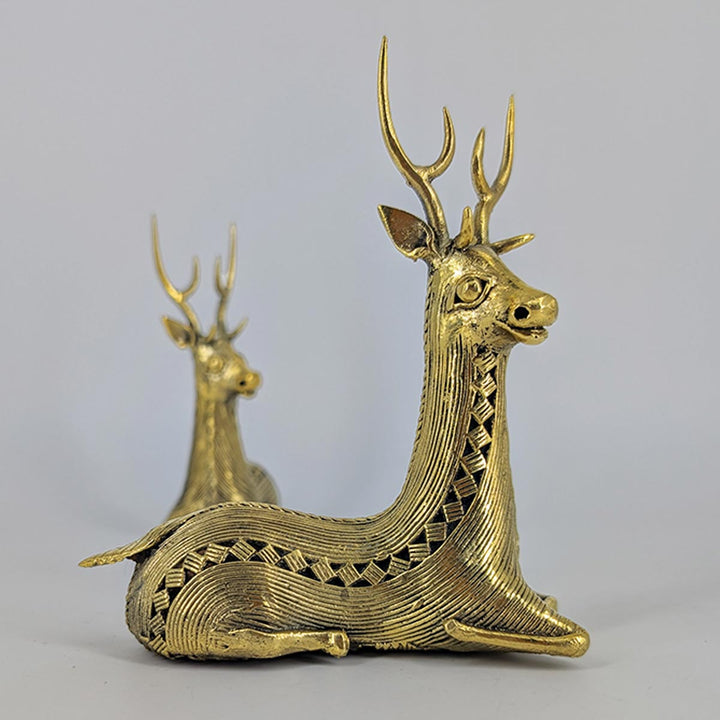 Serene Grace – a pair of seated brass deer figurines for sophisticated home décor.