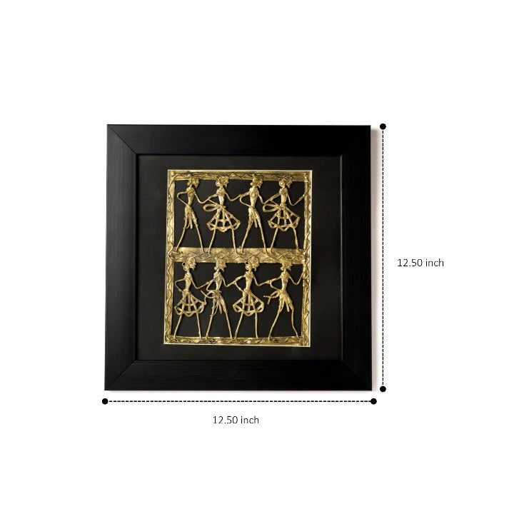Traditional brass wall décor featuring a central drummer and tribal dancers in rhythmic motion.