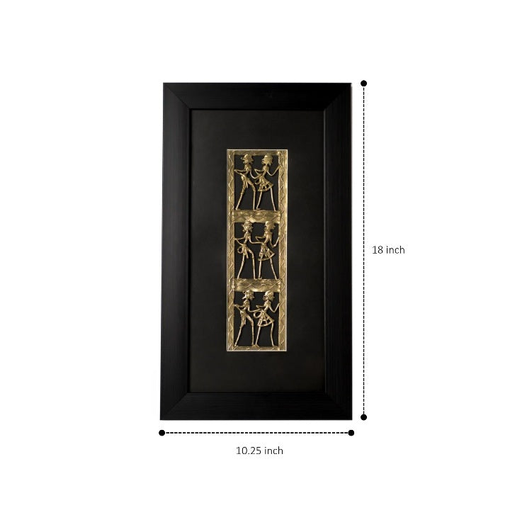 Close-up of intricate Dhokra brass craftsmanship depicting synchronized folk dancers against a deep black backdrop.