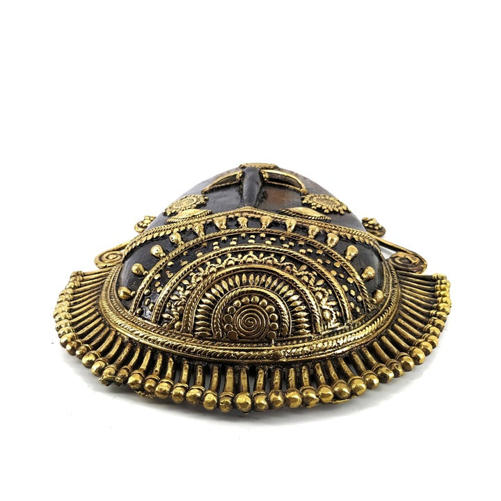 Artisan-made brass tribal mask for ethnic and cultural interiors