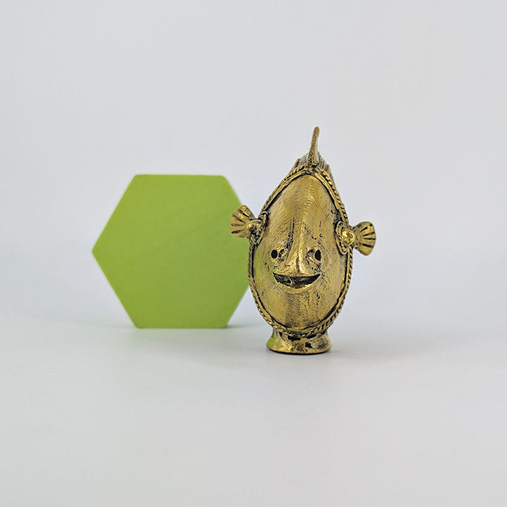 Handmade Dhokra brass fish statue with exquisite detailing and golden hues.