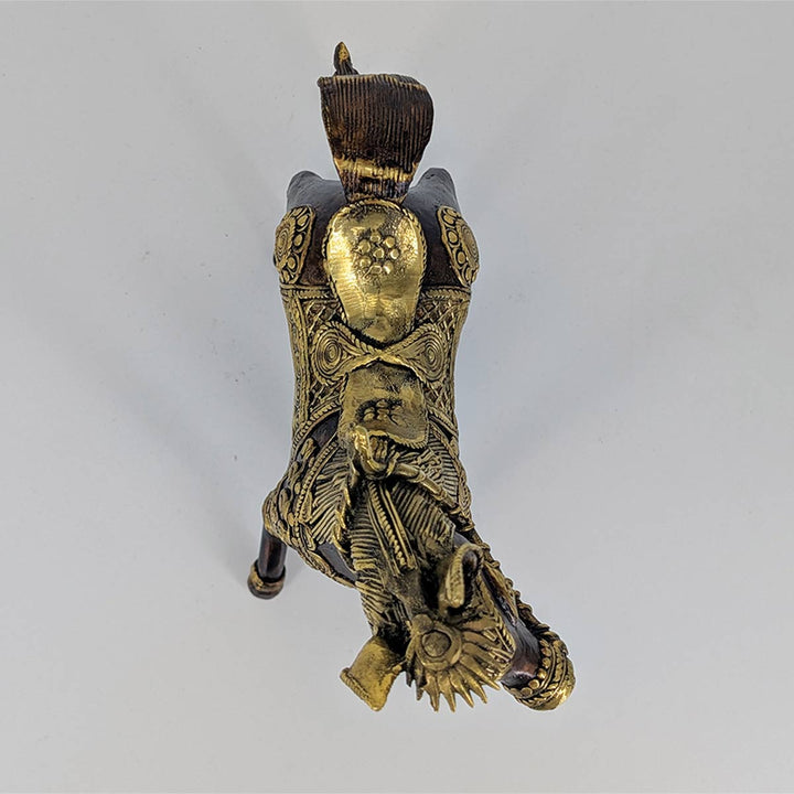 Top-down view of brass horse sculpture highlighting its artistic patterns.