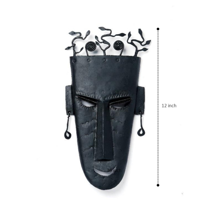Artisanal Bastar Iron Art mask with curved spiral motifs and bold features.