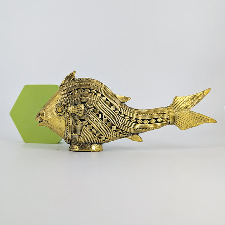 Side view of Flow brass fish sculpture showcasing fluid, wavy details.